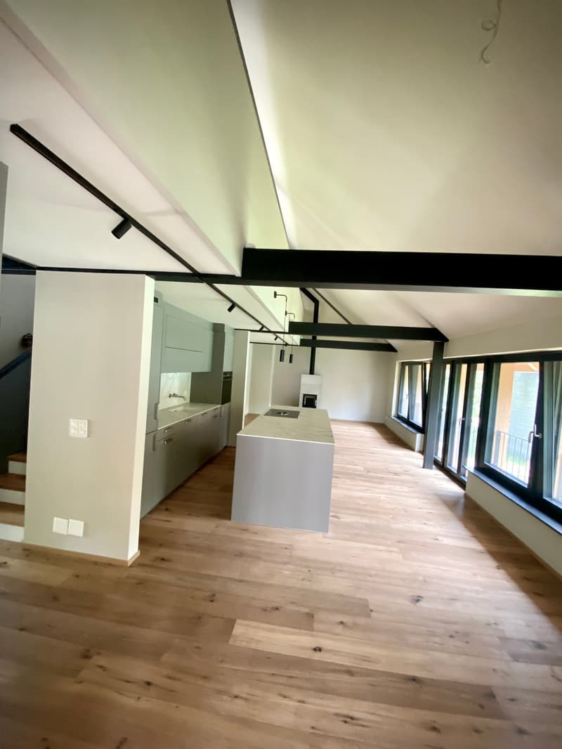 open plan kitchen with island, high wooden ceiling, natural light, white wall, wooden floor, fireplace, large windows