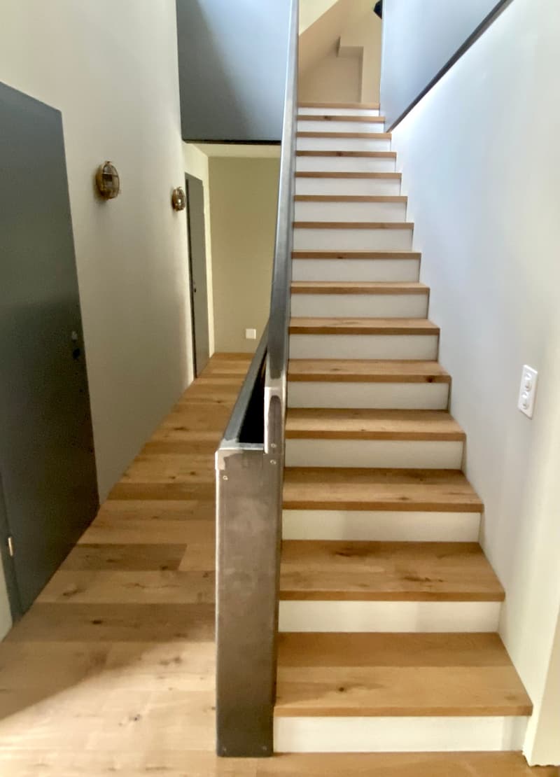 stairs in the house, wooden floor, modern handrail, white walls