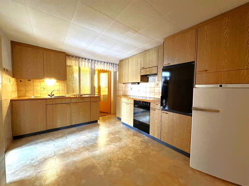 kitchen with wooden cabinets, sink, oven, refrigerator, dishwasher, tiled floor