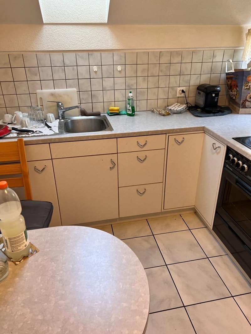 white cabinets, tiled floor, stainless steel sink, gas stove, dishwasher, washing machine
