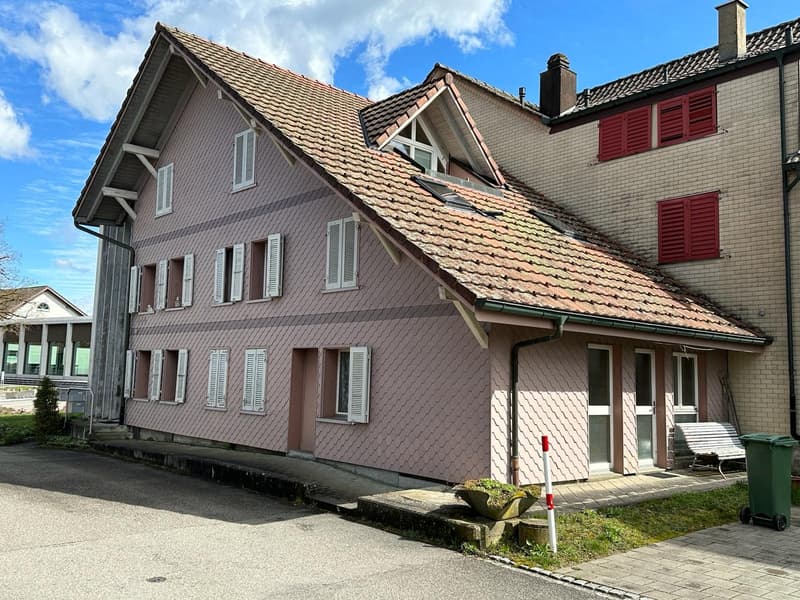 3 story house, red roof, white windows, red shutters, brick wall, front yard