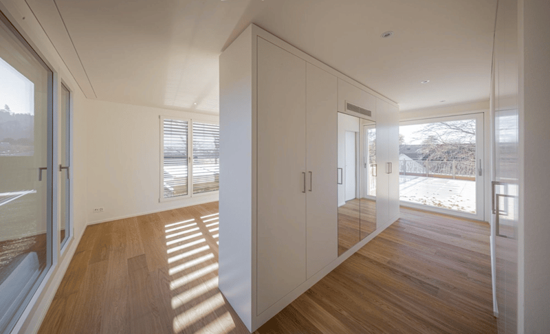 empty room, white walls, wooden floor, large windows, large closet