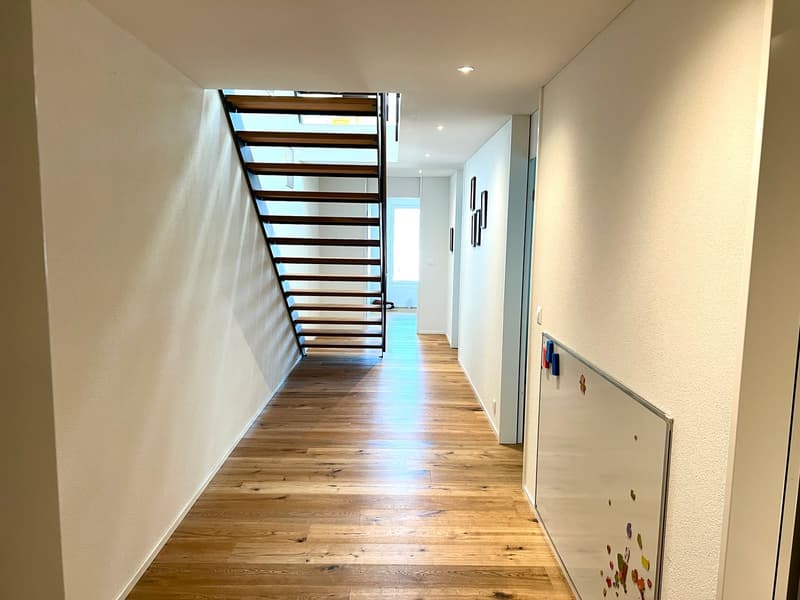 wooden floor, white walls, staircase, hallway