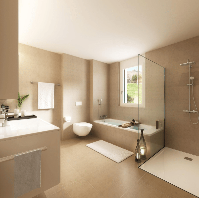 Modern bathroom with beige tiles, glass shower enclosure, bathtub, and white fixtures.