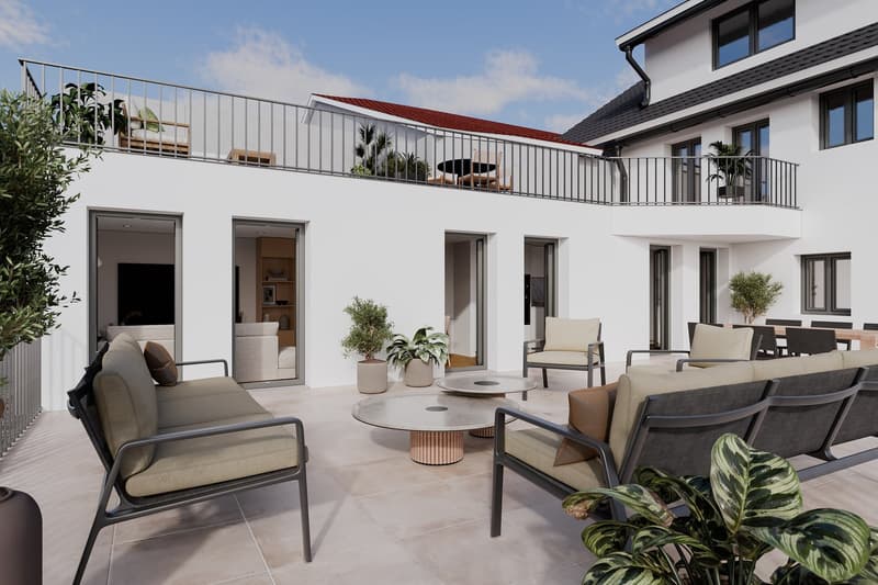 Outdoor lounge area with multiple seating arrangements, tables, plants, and a balcony.