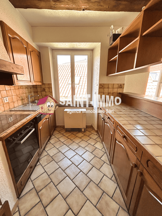 Immeuble locatif à réhabiliter de 4 appartements, un local, une parcelle constructible et un garage 12