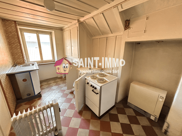 Immeuble locatif à réhabiliter de 4 appartements, un local, une parcelle constructible et un garage 14