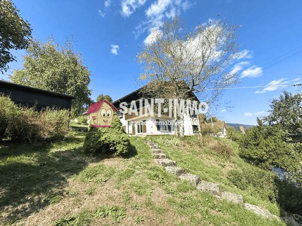 Chalet de deux appartements (3 & 6.5 pièces) avec jardin arboré de 840 m2, terrasse et garages 23