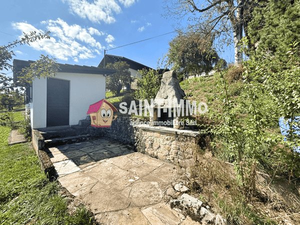 Chalet de deux appartements (3 & 6.5 pièces) avec jardin arboré de 840 m2, terrasse et garages 21