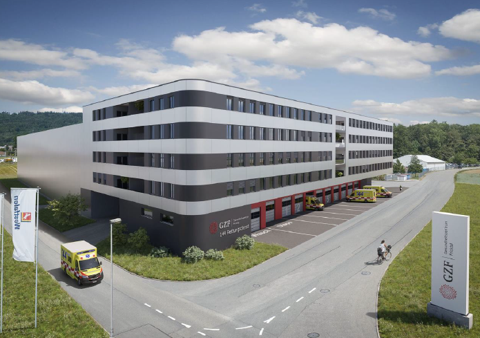 multi-story building, ambulance bay, large parking lot, ambulance