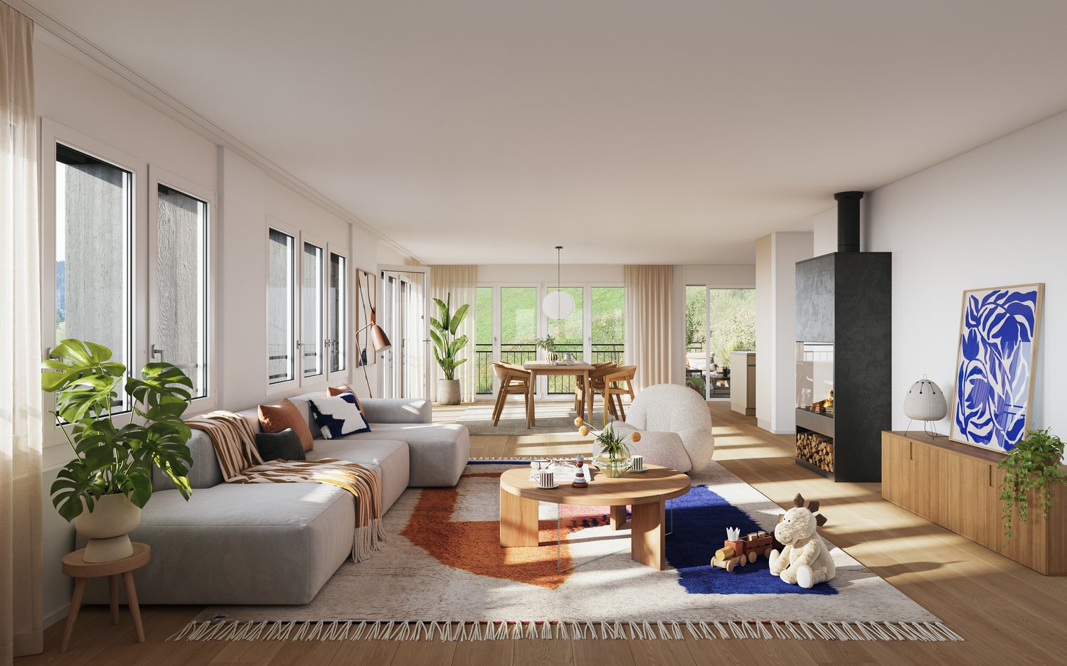 Spacious open-plan living room with large windows, grey sofa, wooden dining table, fireplace, and various decorative elements such as plants and artwork