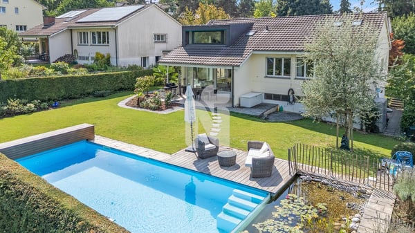 Sehr attraktives Einfamilienhaus auf dem Bruderholz mit Pool, Sauna, Garten und viel Privatsphäre 1