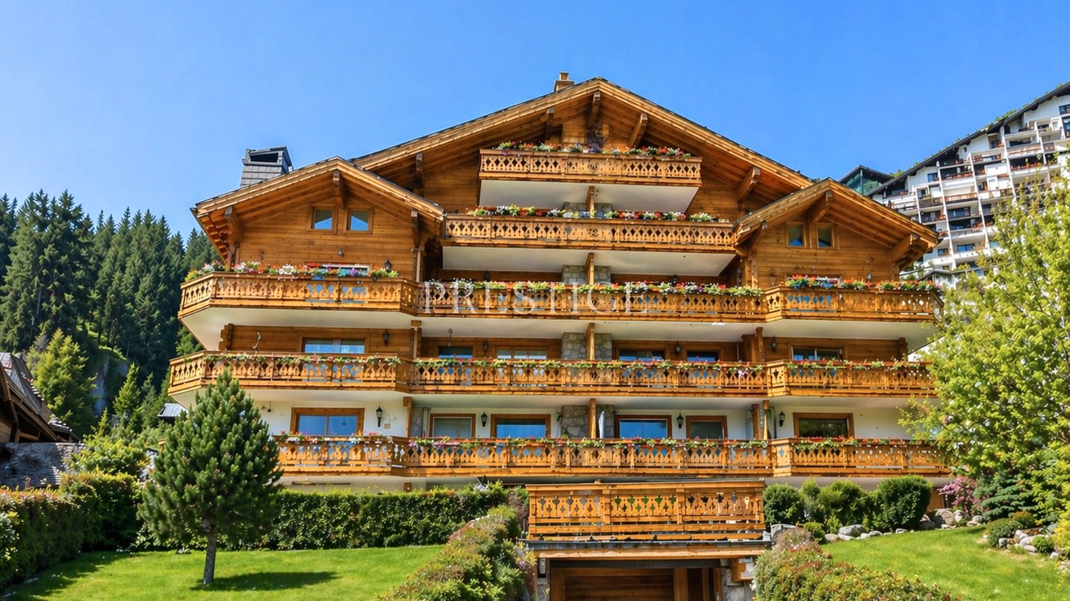 wooden chalet, multiple balconies, flower boxes, surrounded by trees and greenery