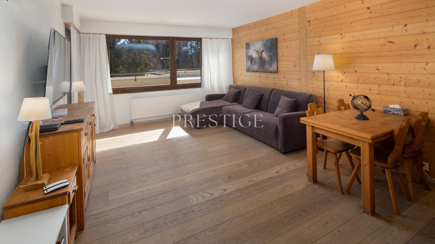 living room with wooden floor, wooden couch, wooden table, wooden chairs, wooden lamp, TV, wooden cabinet, wooden window curtains, wooden wall