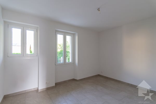 Bâtiment de trois appartements entièrement rénové avec goût 12