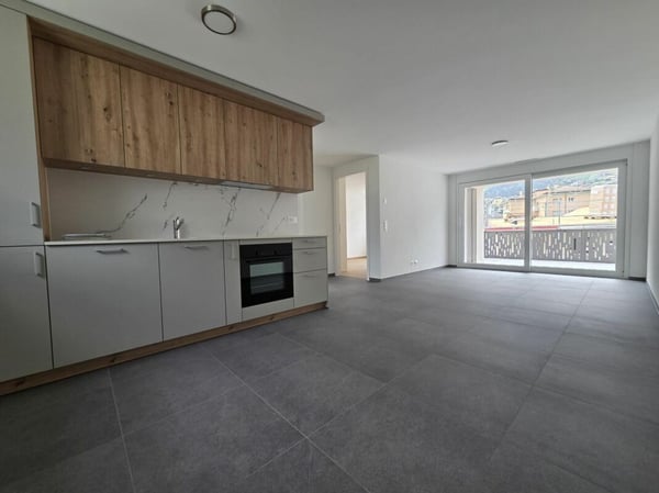 Neuf - Appartement de 3.5 pièces avec balcon et places de parc