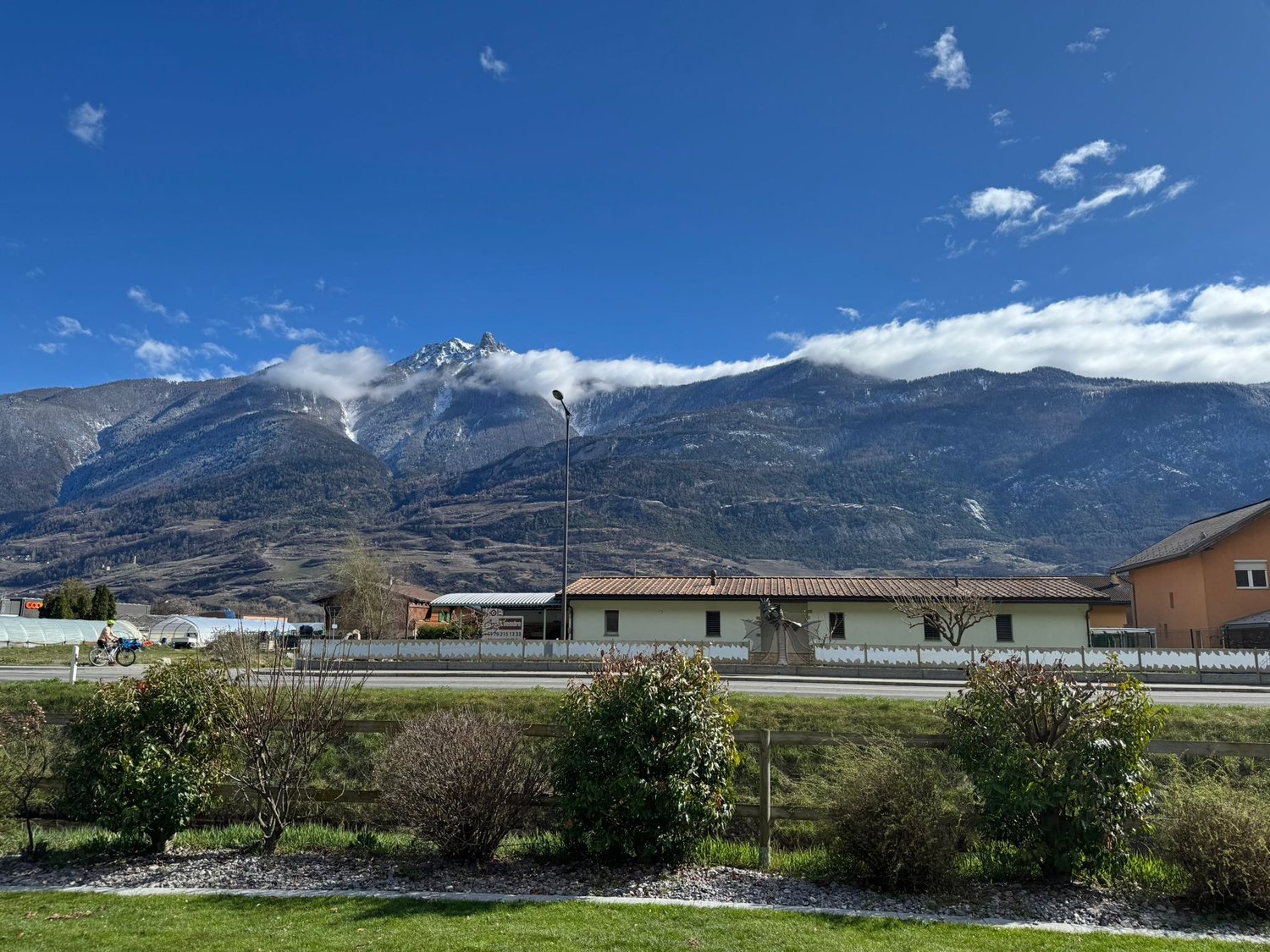 Mountain view, house, road, greenery, mountains in the background