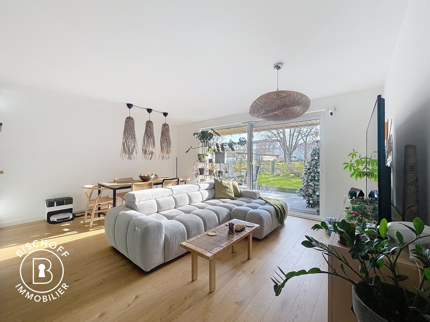 Gray sofa, wooden coffee table, TV, dining table and chairs, potted plants, floor lamps
