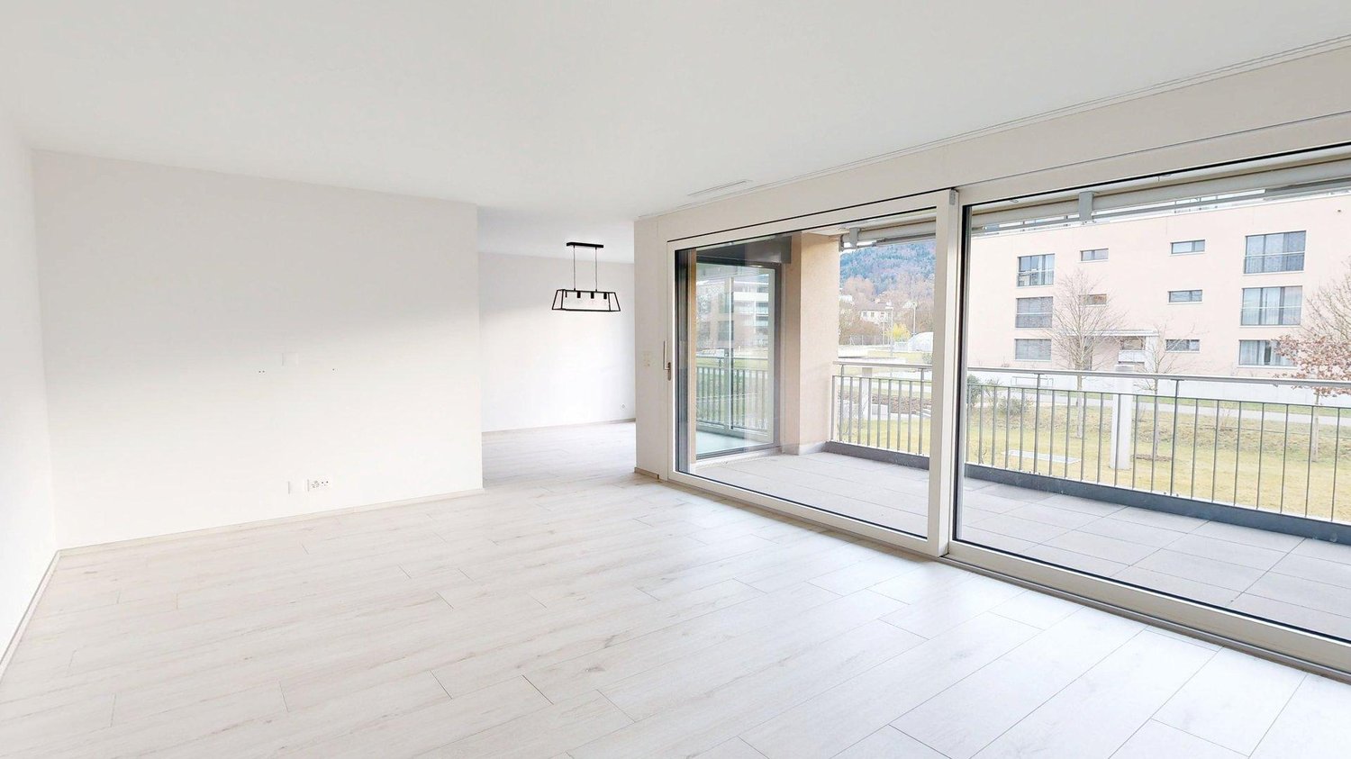 empty room, white walls, white floor, sliding glass doors, balcony
