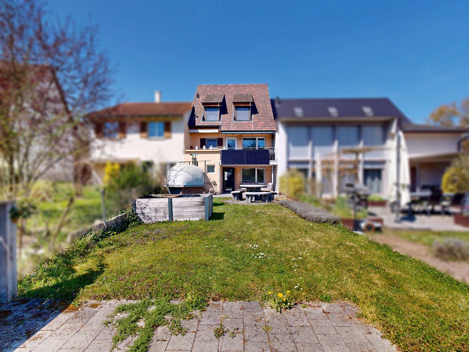 3 story house, brown roof, solar panels, terrace, garden, outdoor seating
