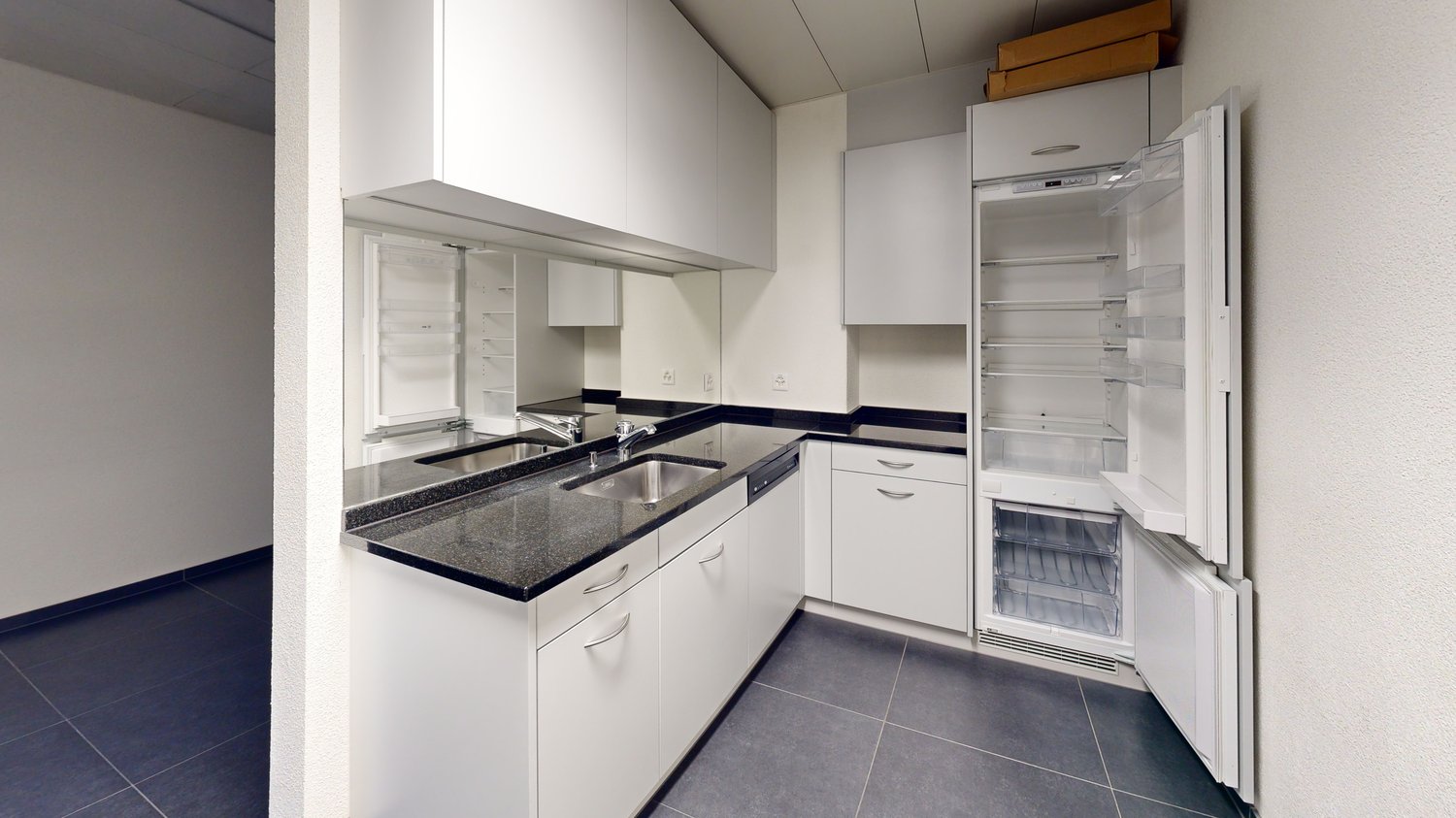 modern kitchen, white cabinets, granite countertops, stainless steel sink, dishwasher, private washing machine, open refrigerator, ceiling fan