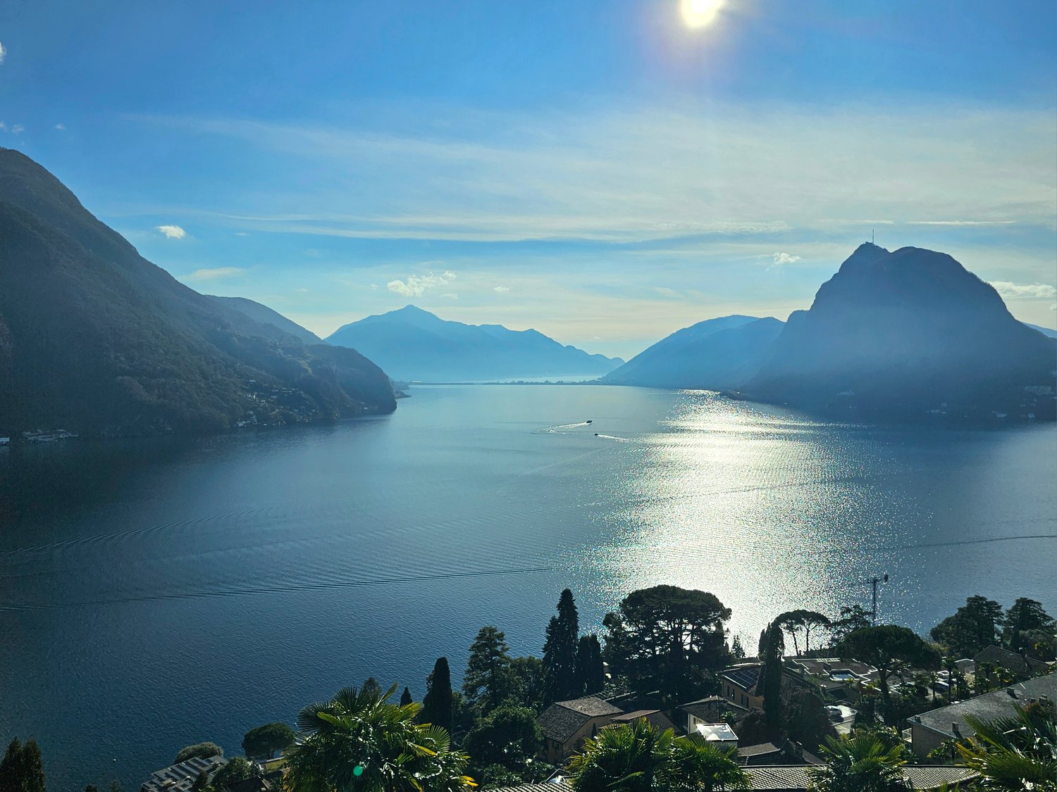 Lake Como, mountains, blue sky, clear water, boats