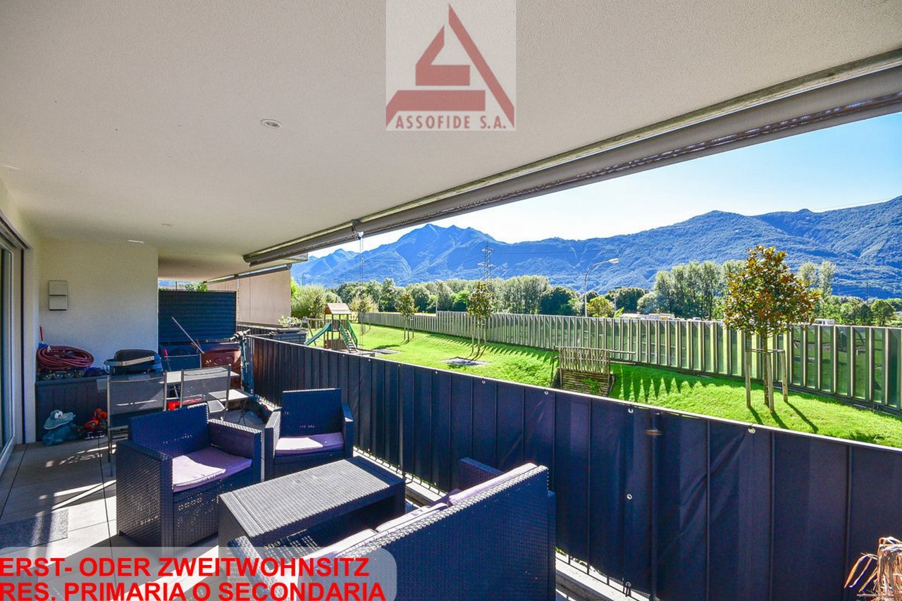 chairs, table, railings, outdoor storage boxes, mountains view