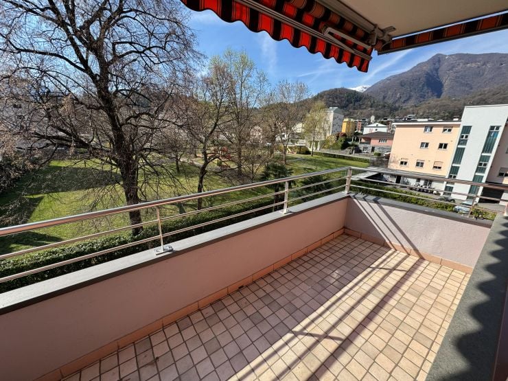 tiled floor, metal railing, view of the mountains and trees