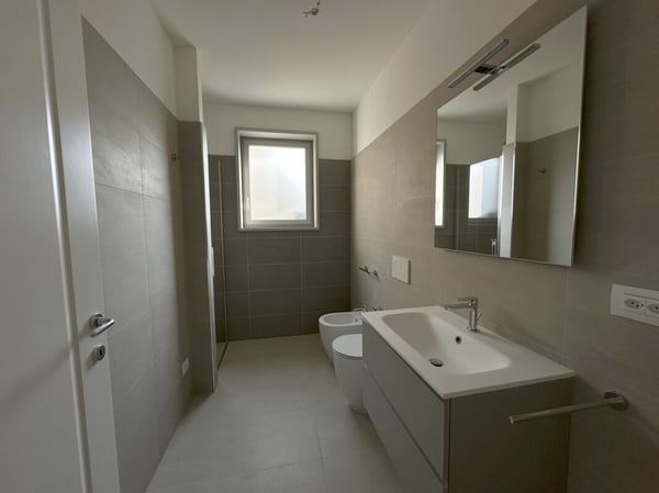 OCCASIONE - Elegante bilocale con giardino privato in residenza di nuova costruzione 8