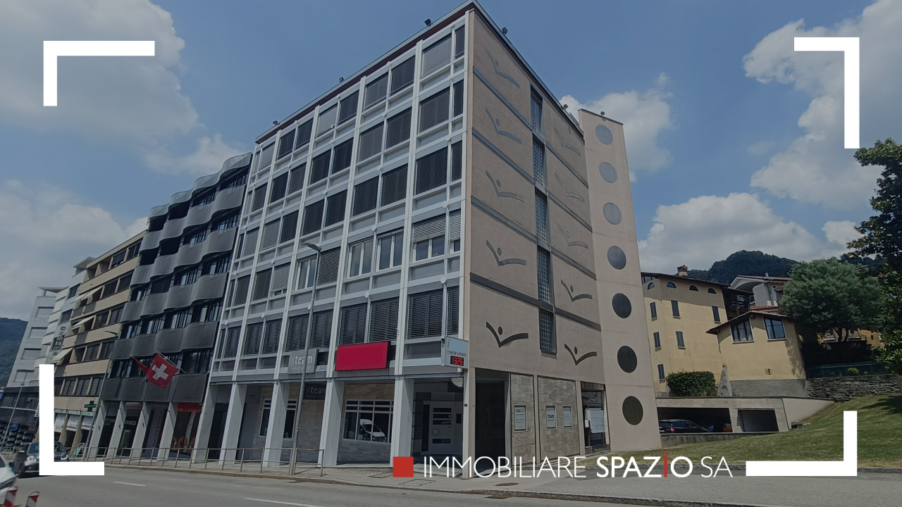 The building features modern architecture, multiple floors, large windows, and a flat facade.