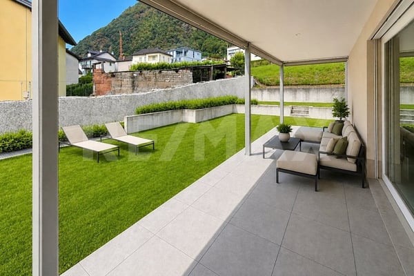 Appartamento 3.5 con giardino e 2 posti auto 1
