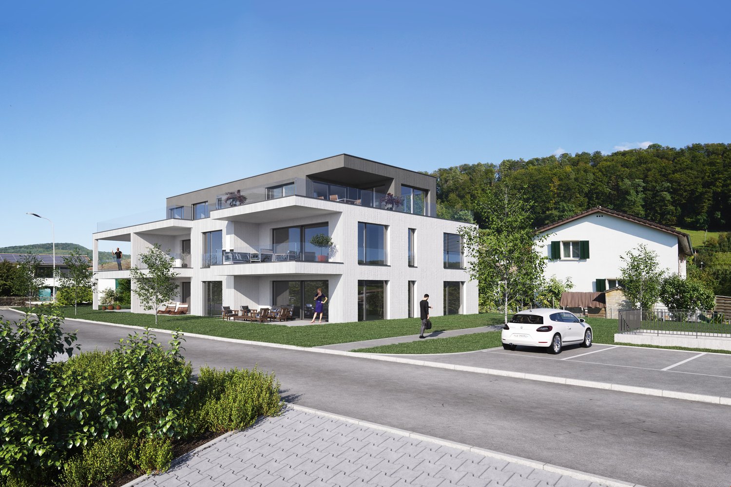 Modern apartment complex with 4 stories, several balconies, large windows, and green areas around