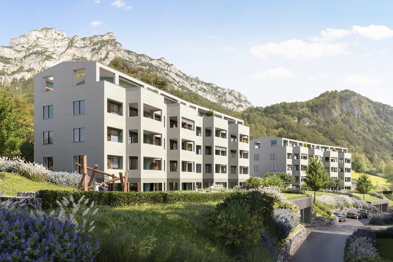 3-story building, white walls, large windows, balconies, green roof, garden, parking spots, grassy hills, mountains in the background