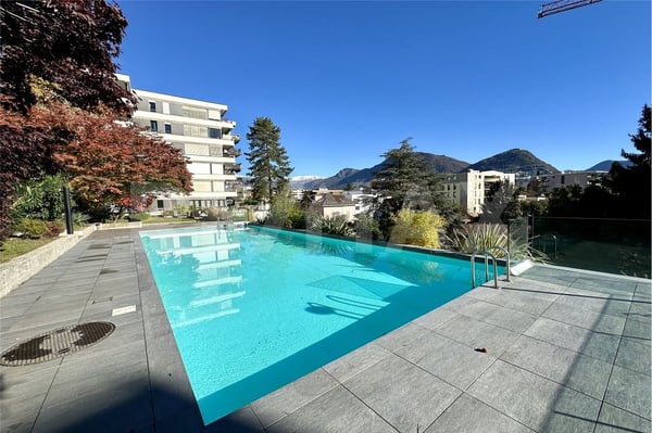 Appartamento 4.5 locali con vista mozzafiato su Lugano e il Monte Brè 1