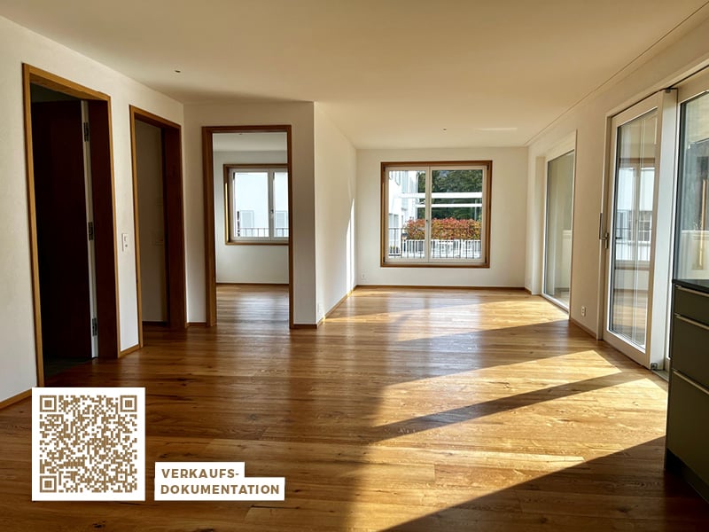 Open room, hardwood floors, two doors, double windows, sliding doors, balconies, view of trees