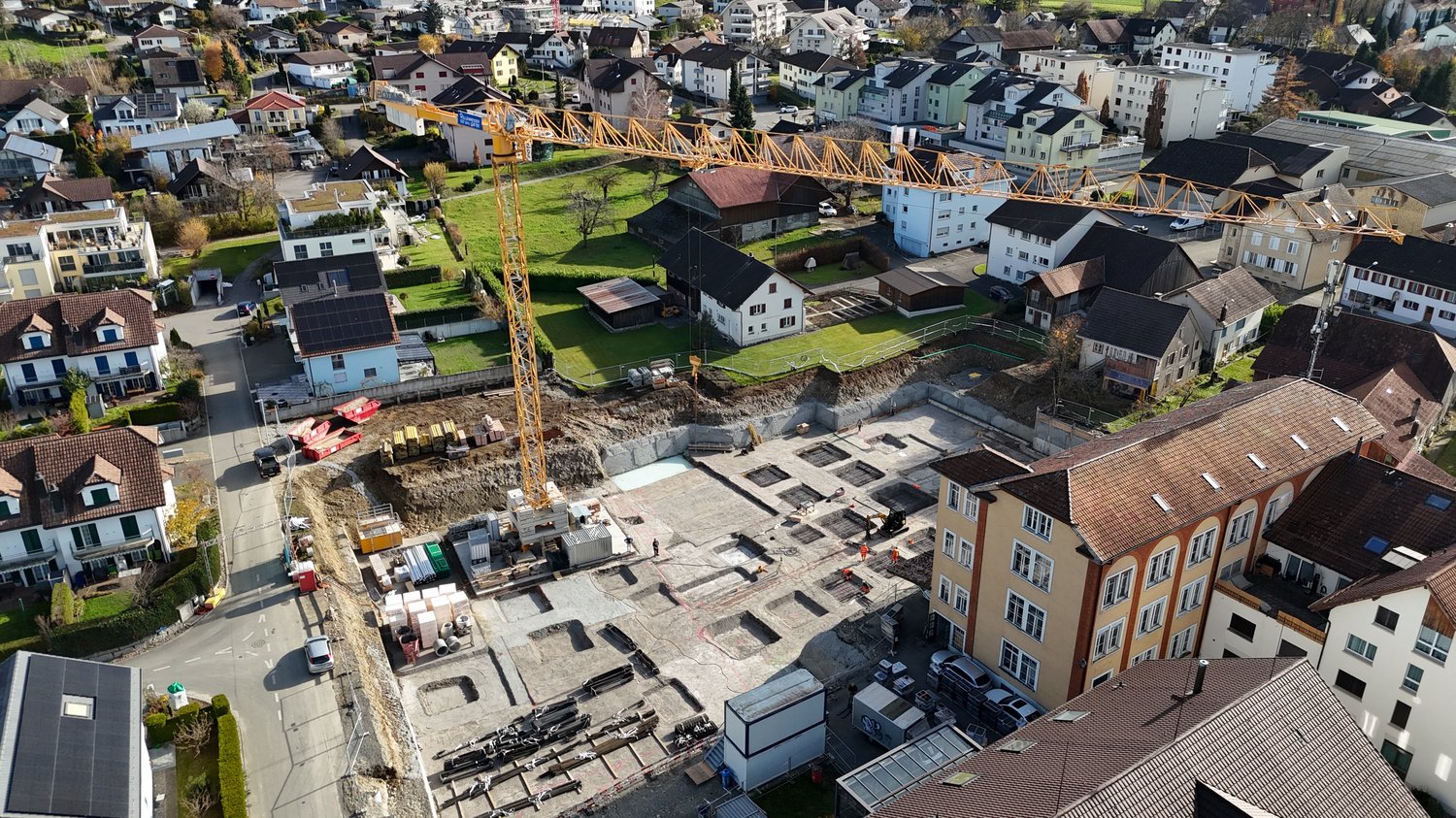 Construction site, various houses in different stages of completion, residential area