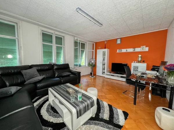 Immeuble idéalement situé avec places de parc et rendement de 6.5% 13