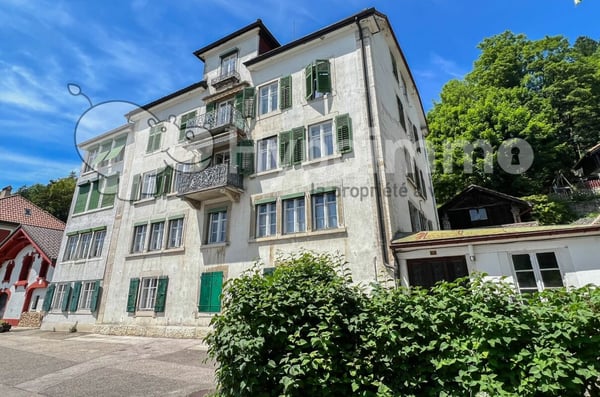 Immeuble idéalement situé avec places de parc et rendement de 6.5% 1