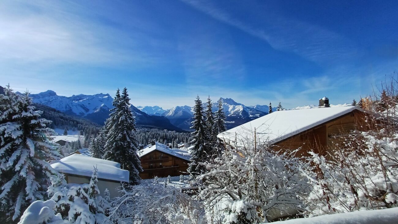 Three-story chalet in the residential complex with panoramic views of the Alps.