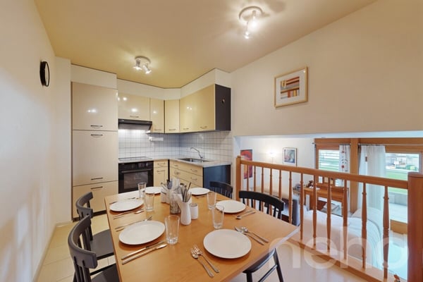 Appartement 2,5 pièces en rez-de-jardin avec piscine intérieure 1