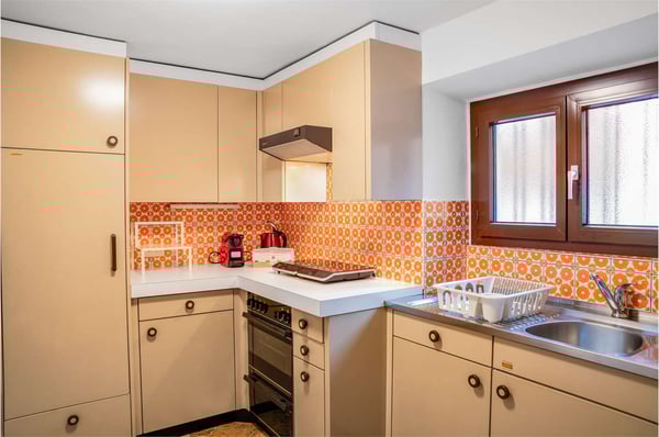 PALAZZINA A REDDITO A COMANO 2