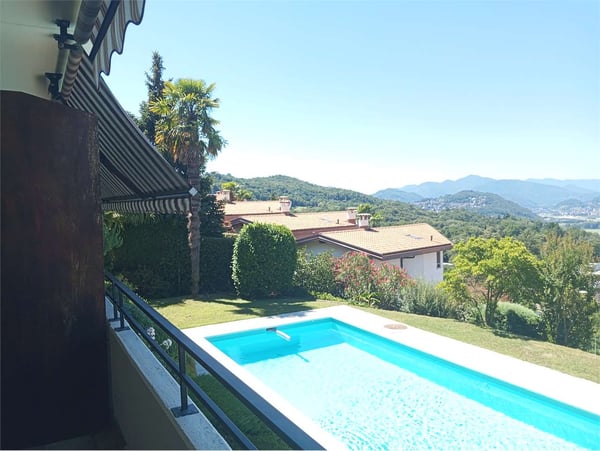 Comano - Elegante appartamento 2.5 locali con piscina e vista panorami 7