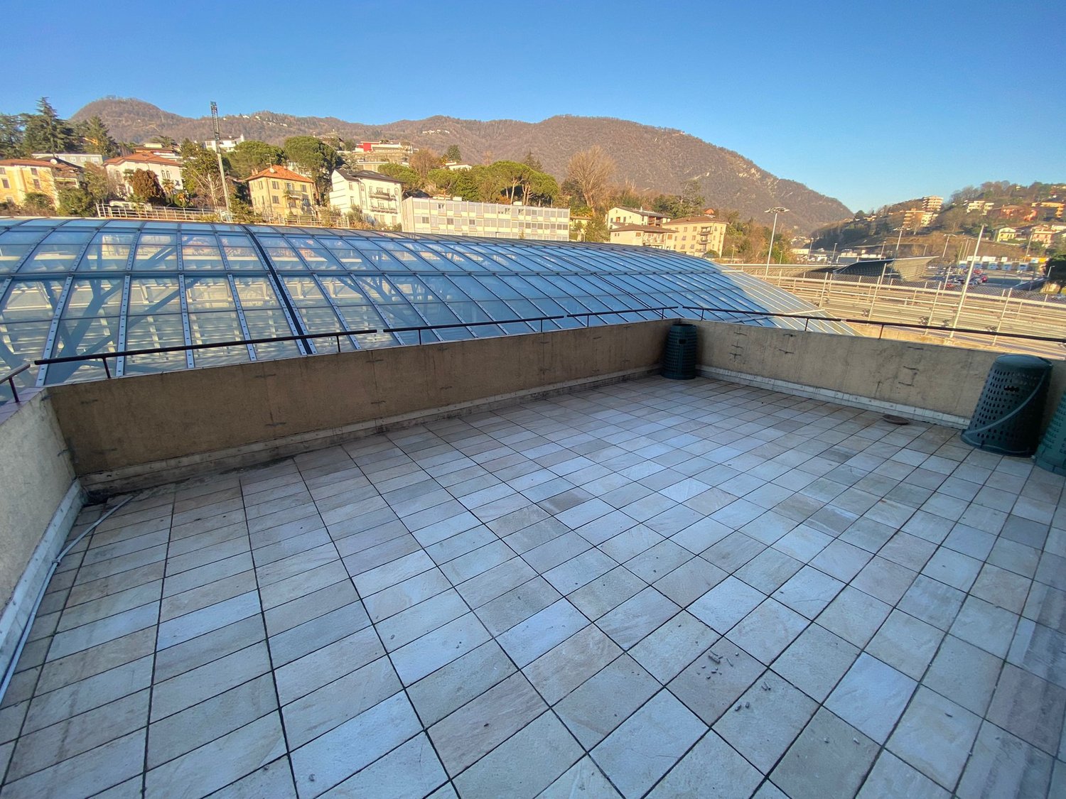 tiled floor, glass canopy, view of the city