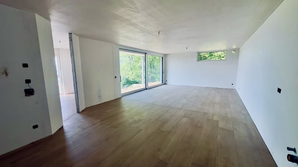 ESCLUSIVO E NUOVO 4.5 LOCALI CON GIARDINO IN CAPRIASCA 1