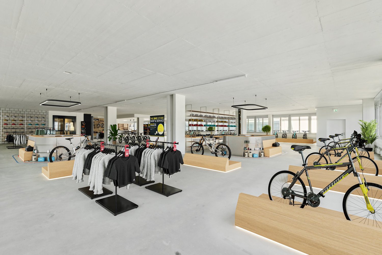 modern bicycle shop with clothing and bicycles