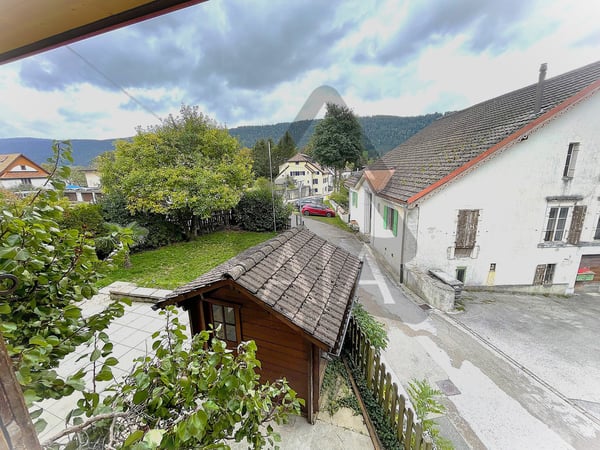 Couvet, belle maison familiale de 4 appartements avec jardins et terrasses au Centre-Nord du Village 31