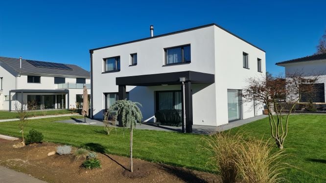 Modern 2 story house, white exterior, solar panels, covered terrace, spacious front yard