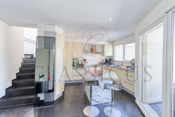 Maison familiale en pignon avec jardin privatif, véranda et 4 stationnements 6