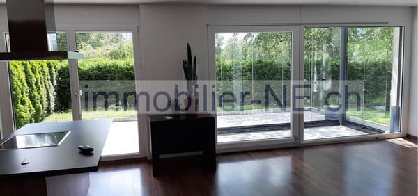 Bel appartement de 3,5 pièces, bénéficiant d'un jardin privatif et d'une place de parc intérieure 1