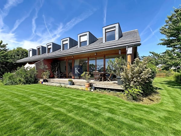 Charmante maison jumelée de 5.5 pièces avec jardin arboré et terrasse ensoleillée 1